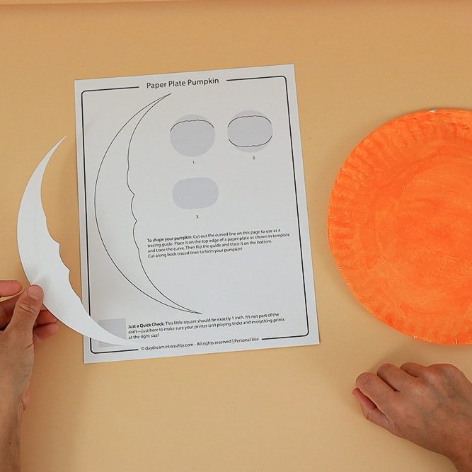 template for shaping paper plate into a pumpkin