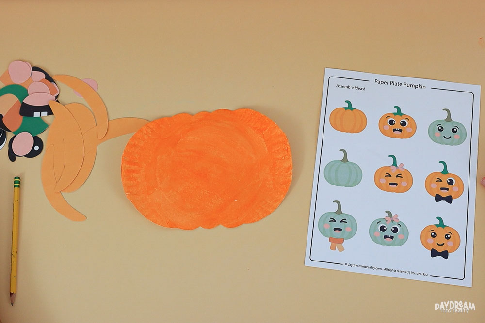 paper plate pumpkin ready to be assembled