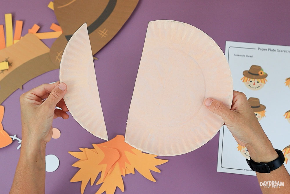 cut paper plate to form the face