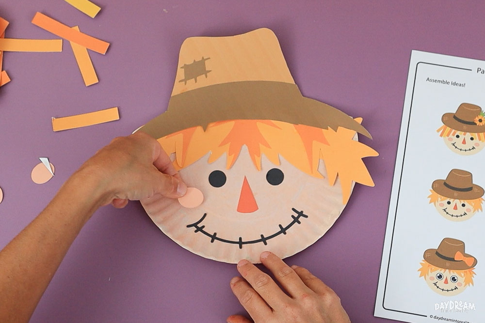glue cheeks to scarecrow