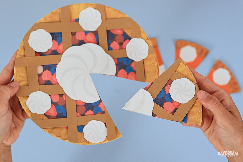 cutting paper plate mixed berry pie craft into slices