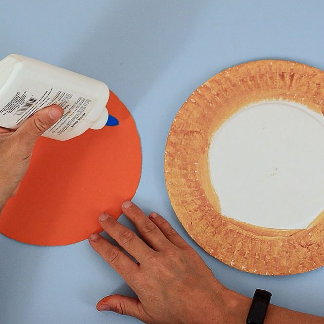 gluing the orange filling onto the plate (crust ring shows)