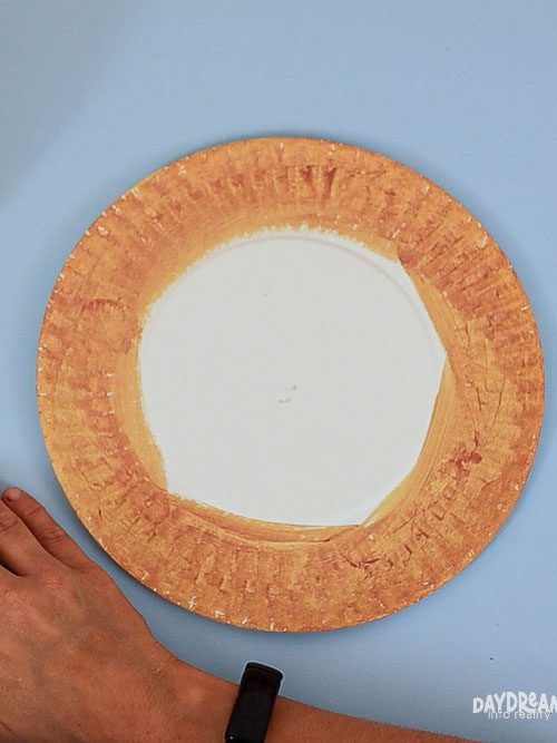 gluing the orange filling onto the plate (crust ring shows)