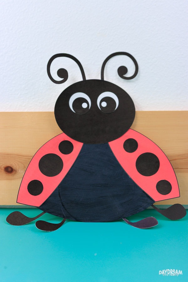 Cute paper plate ladybug sitting down.