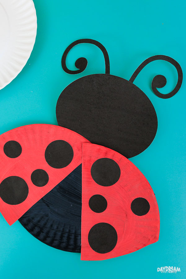 Cute paper plate ladybug ready to fly.