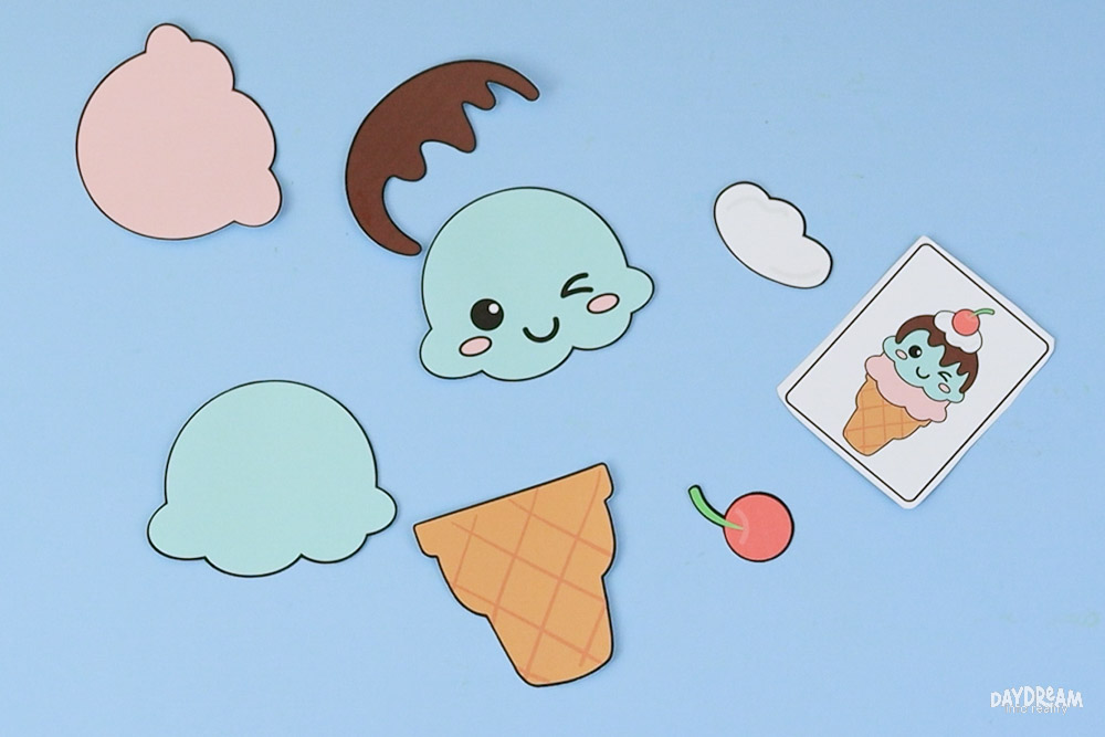 Ice cream cone craft pieces arranged and ready to assemble.