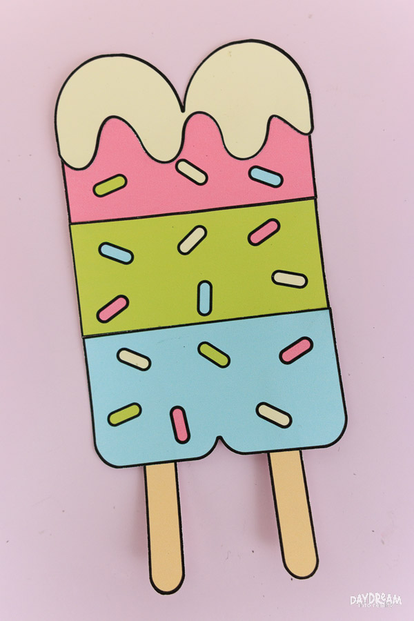 Cute twin popsicle craft for kids with sprinkles and different flavors.