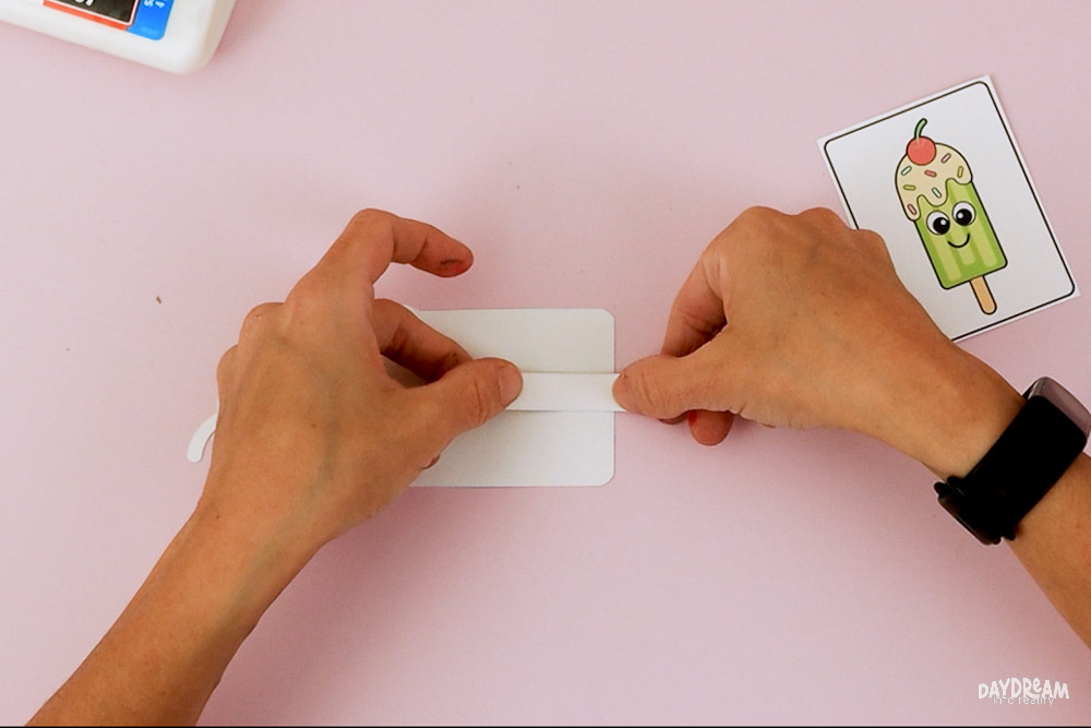 Flip the popsicle and glue popsicle stick.