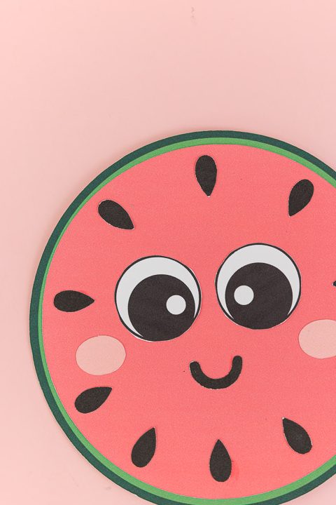 Cute round watermelon craft for kids with kawaii smiling face.