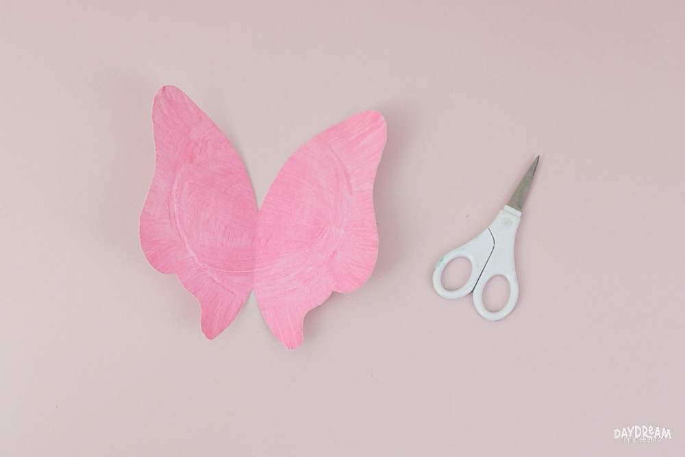 Open paper plate to reveal butterfly