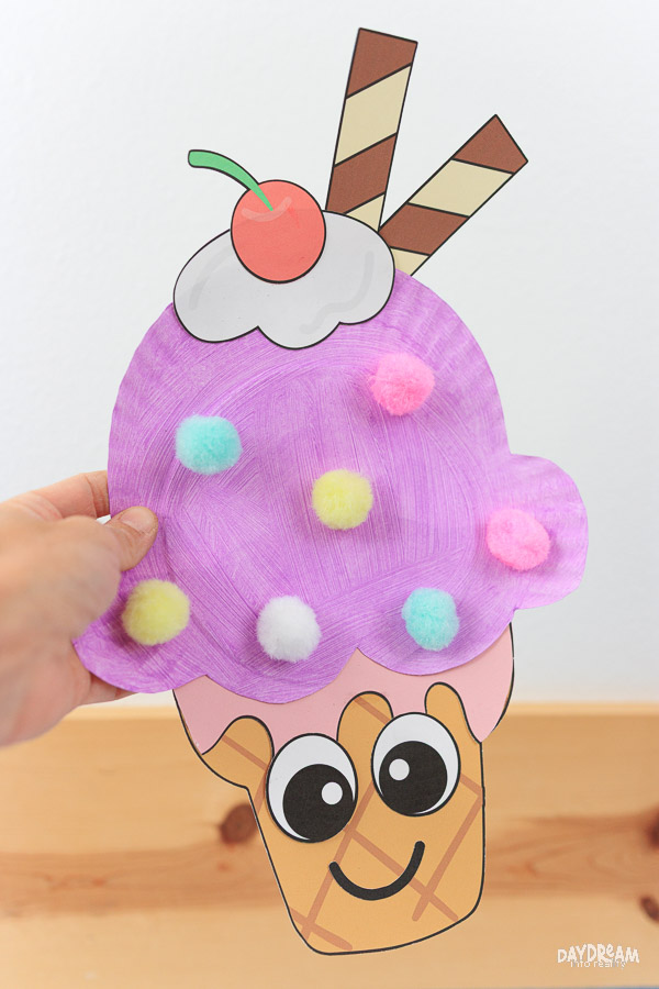 Cute paper plate ice cream with pom poms.