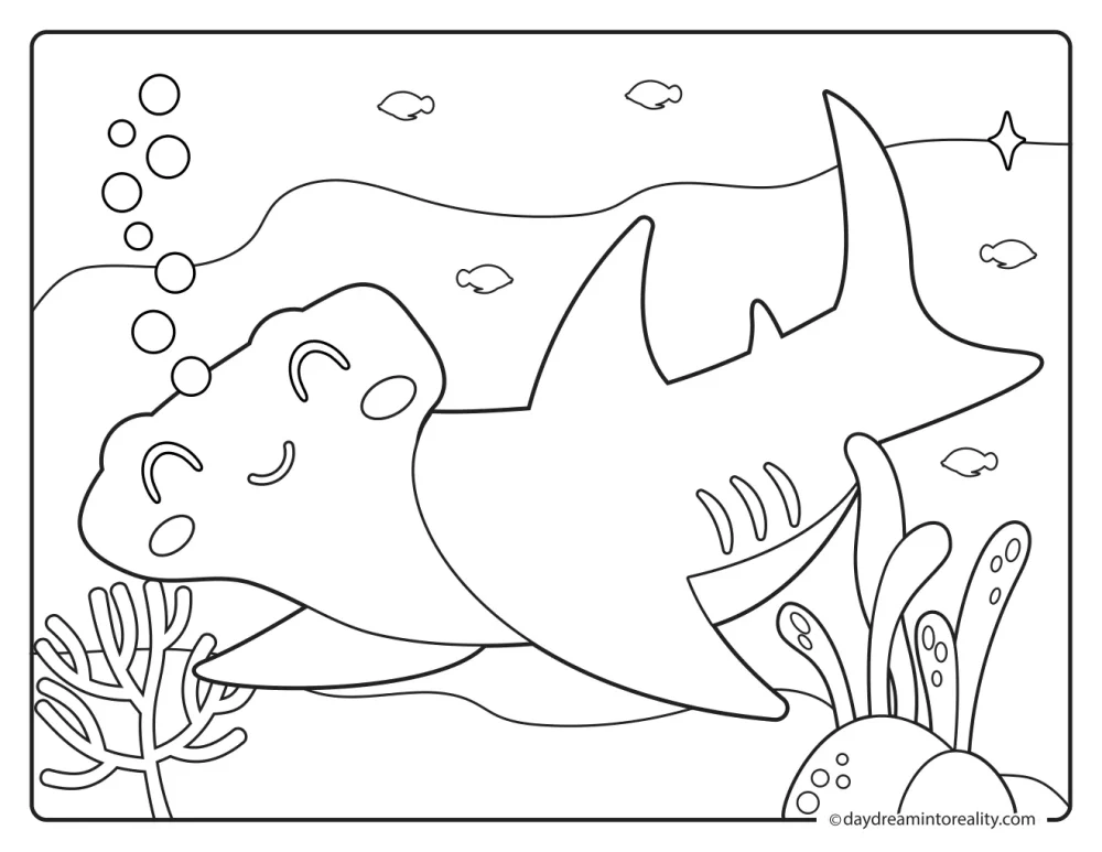 Smiling hammerhead shark swimming near coral, sea plants, bubbles, and small fish.